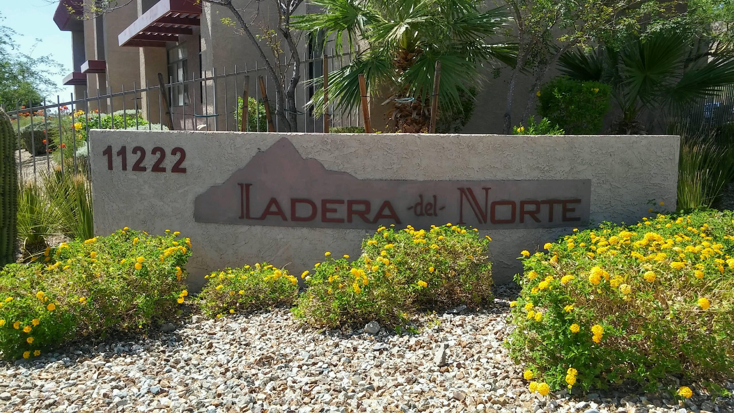 the sign in front of the entrance apartments